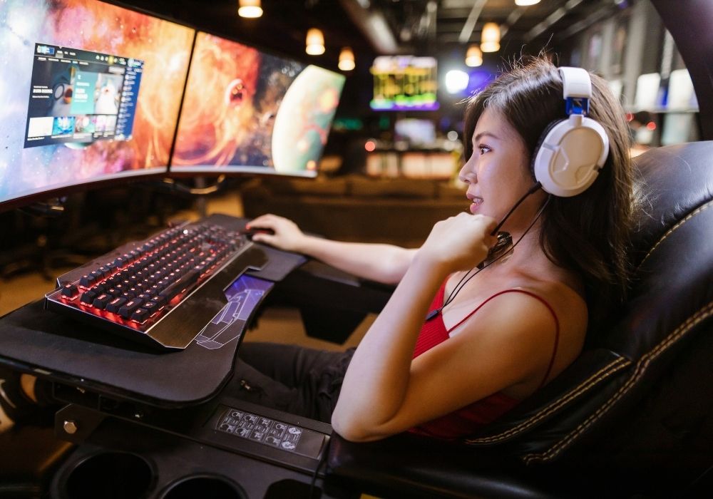 Asian Girl Playing Video Game on PC